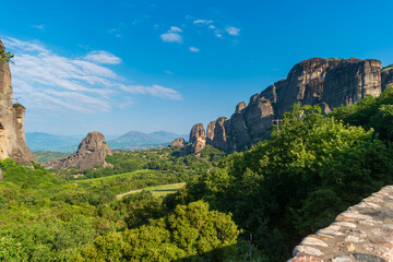 Fototapeta na wymiar View of the natural landmark Rocks of Mount Meteora with a monastery at the top. Landscape of the Thessaly Plain, Greece.