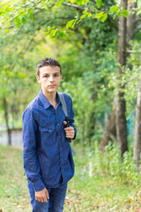 teenager goes to school, a young man carries a bag