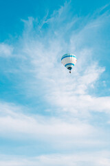hot air balloon flying in a clear blue sky