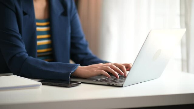 business woman working with digital tablet computer and smart phone with financial business strategy layer effect on desk