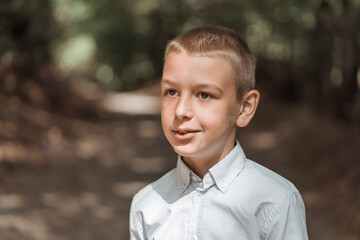 portrait of a handsome boy outdoor in natural light