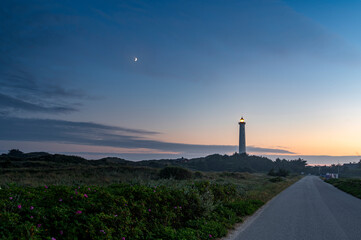 lyngvig lighthouse at sunset. Old and proud lighthouse that have stood for many years - obrazy, fototapety, plakaty