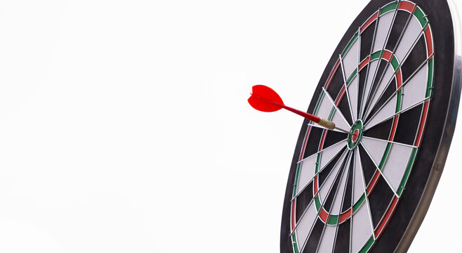 Bullseye is a target of business. Dart is an opportunity and Dartboard is the target and goal. So both of that represent a challenge in business marketing as concept.Dartboard and arrow on white