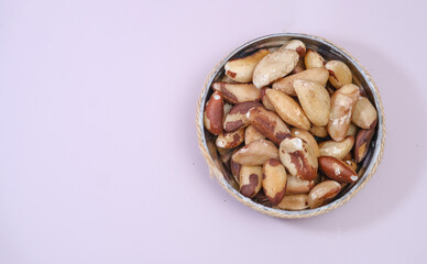 Brazil nuts isolated on white background. Shelled Brazil nuts closeup, copy space for business.