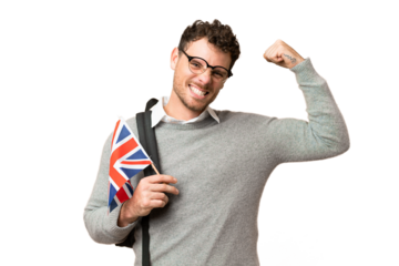 Brazilian man holding an United Kingdom flag over isolated chroma key background doing strong gesture