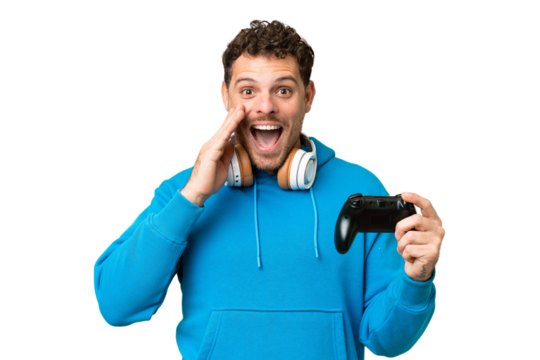 Brazilian man playing with a video game controller over isolated chroma key background with surprise and shocked facial expression