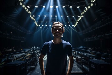 Fototapeta na wymiar Photo of a man illuminated by stage lights