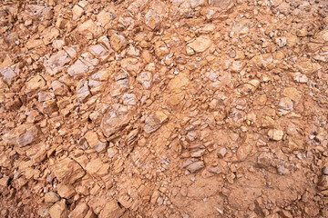 Weathered rock background. Brown highly weatered stone.