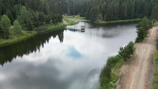 Aerial view lake in forest. Beautiful spring landscape with mountains, forest and lake. Beautiful touristic places in Turkey. Sinop ak gol