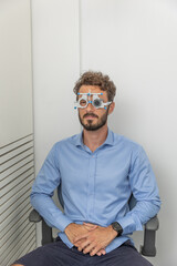 Examination of the eyes and vision. Man chacking his vision at eye doctor