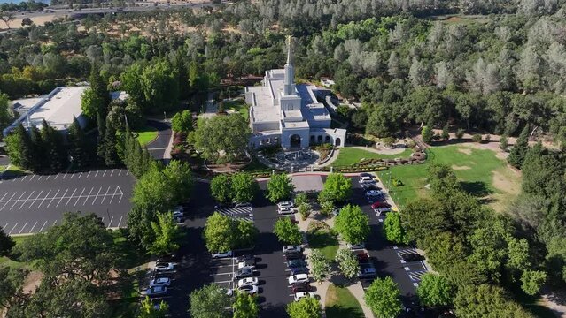 Aerial Sacramento California LDS Temple front. The Church of Jesus Christ of Latter-day Saints, Mormon or LDS church. Christian religion builds sacred building for worship. Overhead. 4K HD video