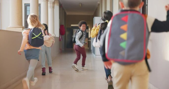 School, students and children in hallway running with backpack, excited for learning and education from back. Smile, fun and knowledge, happy young friends together outside classroom with energy.
