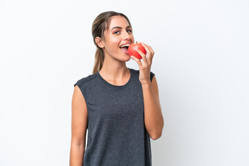 Young pretty Uruguayan woman isolated on white background eating an apple - Powered by Adobe