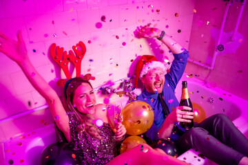 Couple drinking champagne at New Year party midnight countdown