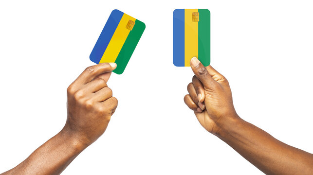 Black Hands Holding ATM Cards 
Coated In Gabonese Flag Colors Isolated On Transparent Background. Male Hand Holding Blank Paper Card, Card Template, Clip Mask	