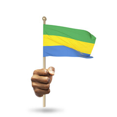 Hand holding Gabonese national flag isolated on transparent background