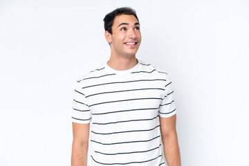 Young caucasian man isolated on white background thinking an idea pointing the finger up