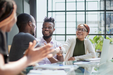 african business people handshake at modern office