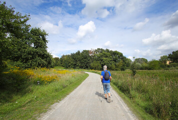 Fototapeta premium A senior does Nordic walking in Kienbergpark Berlin-Marzahn, Germany