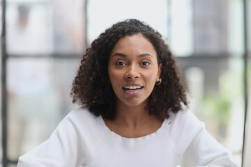 Happy business woman smiling inside office building