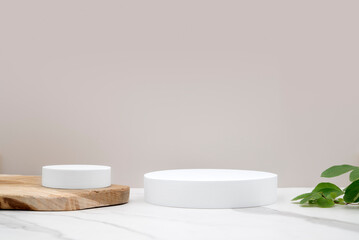 Circular podium for product presentation. Wooden and white marble surface. Photo studio, minimal...