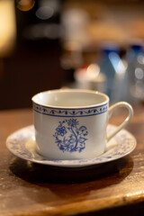 A cup of aromatic coffee in a white cup in a cafe on a table