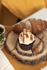 Cake chocolate cupcake with cream and caramel