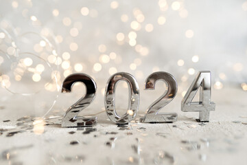 happy new year 2024 background new year holidays card with bright lights,gifts and bottle of...