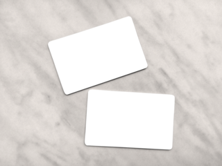 Double-sided business card template with rounded edges on a gray marble background. Business card mockup. Two white or transparent frames with copy space