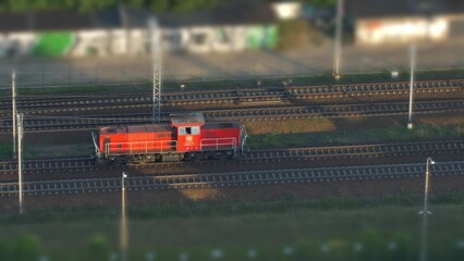 Aerial of Electric Locomotive Engine on Multiple Tracks Railway Tilt-Shift