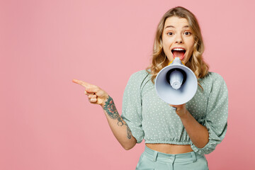 Young shocked excited happy woman wear casual clothes hold in hand megaphone scream announces...