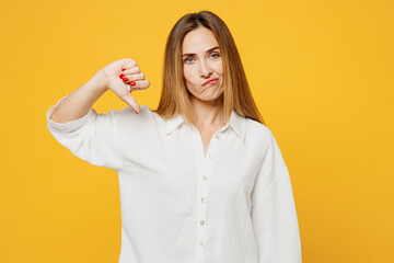 Young dissatisfied displeased upset sad caucasian woman she wears white shirt casual clothes...