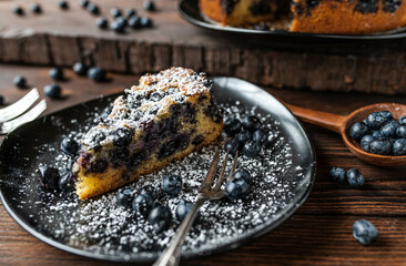 Rustic blueberry cake on wooden table