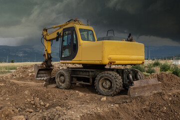 Fototapeta premium Excavator at a construction site at the end of the day