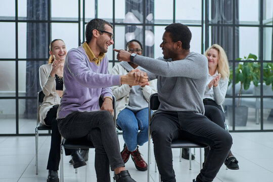happy friendly diverse professionals, teachers and students giving high five while