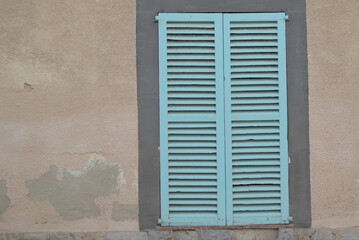 light blue rustic wooden window blind