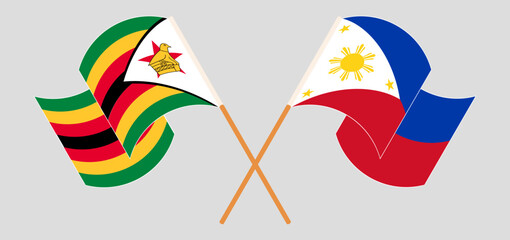 Crossed and waving flags of Zimbabwe and the Philippines