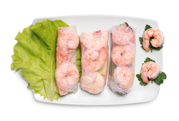 Delicious spring rolls with shrimps wrapped in rice paper on white background, top view