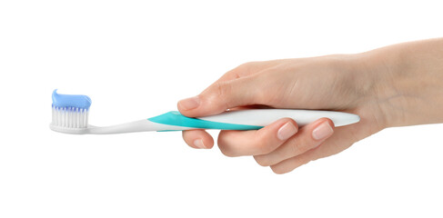 Woman holding toothbrush with paste on white background, closeup