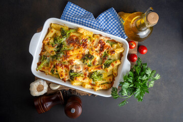 Pasta baked with broccoli and chicken. Broccoli, cheese and gratin sauce on baked penne pasta.