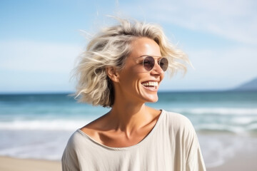 Fototapeta na wymiar Ageless beauty: confident woman proudly showcasing her gray hair on the beach