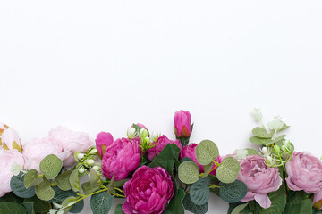 Styled stock photo. Decorative still life floral composition. Wedding or birthday bouquet of pink and white peony flowers and eucalyptus branches. White table background. Flat lay, top view
