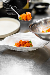 chef cooking Seviche with salmon and avocado on kitchen
