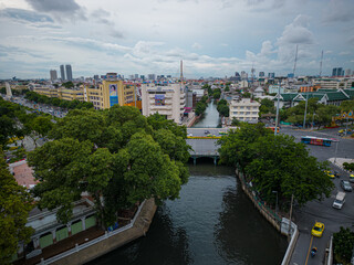 Riverside old town village with modern office building in Bangkok Thailand