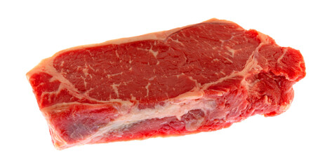 Side view of single New York strip steak isolated on a white background.