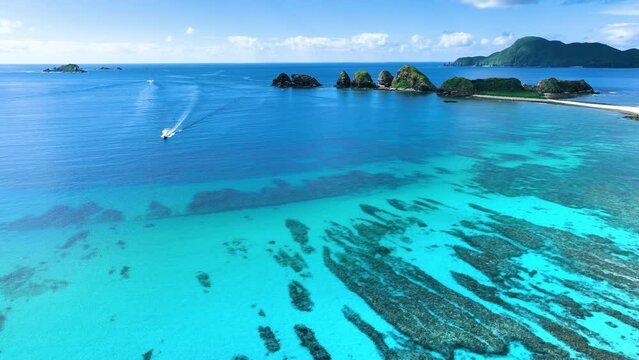 Establishing aerial drone shots of pristine parts of Kerama islands, Okinawa.