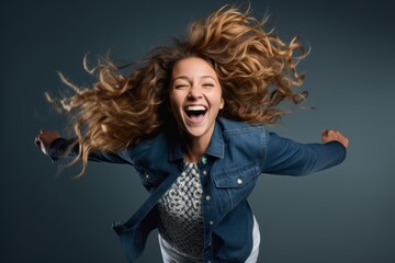 Headshot portrait photography of a joyful girl in her 20s jumping with joy against a navy blue background. With generative AI technology