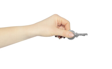 A woman's hand holds a key in her hand, isolated from the background. The concept of security, house trade.