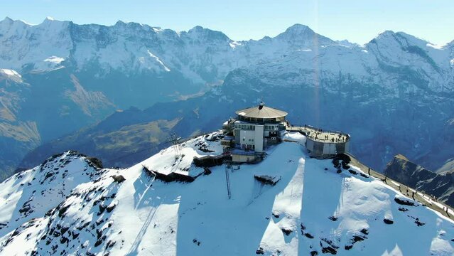 Schilthorn piz Gloria: fantastic aerial view traveling out over the station and with snow-capped mountains and a spectacular landscape.