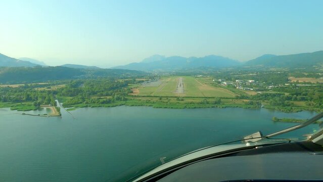 Airplane landing at Chambery airport, France. Real time, cockpit POV